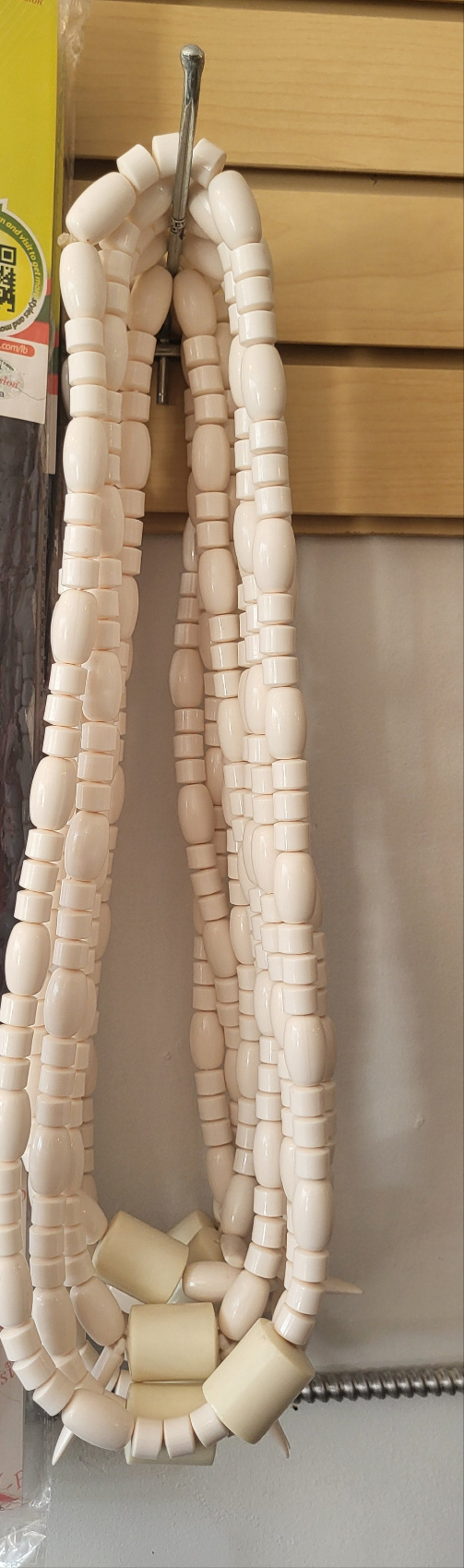 Nigerian traditional cultural bride and groom long neck bead
