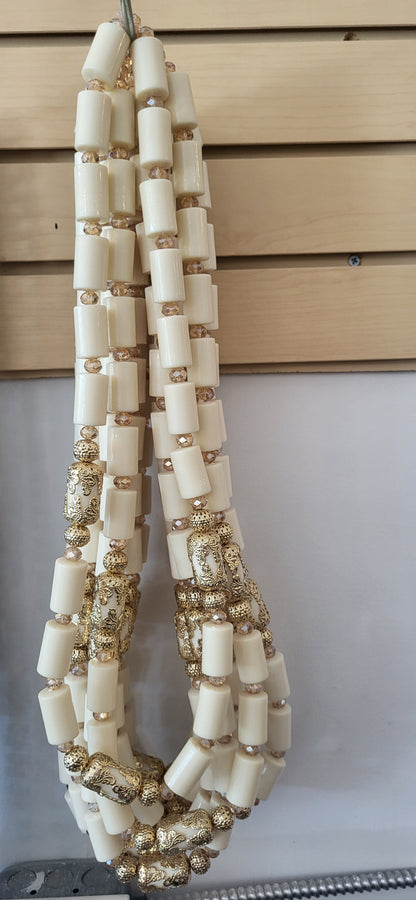 Nigerian traditional cultural bride and groom long neck bead
